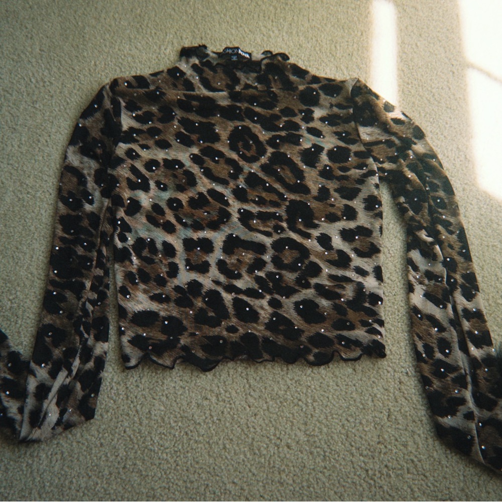 Fashion Nova Mesh Leopard Print Long Sleeve Top with black Feathers on the arms